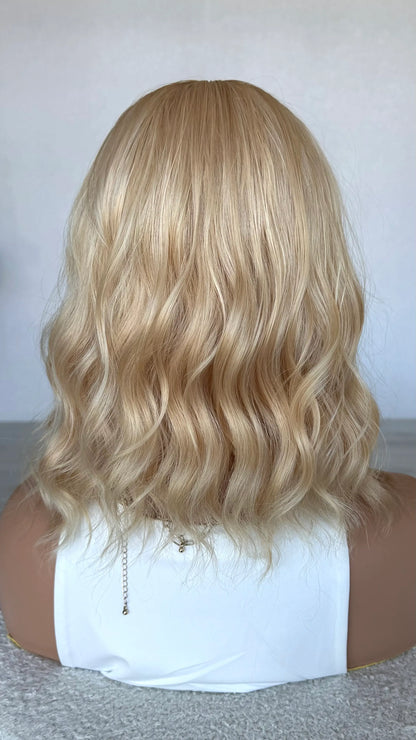 honey wig from the back view, wavy blonde hair wig. australia.