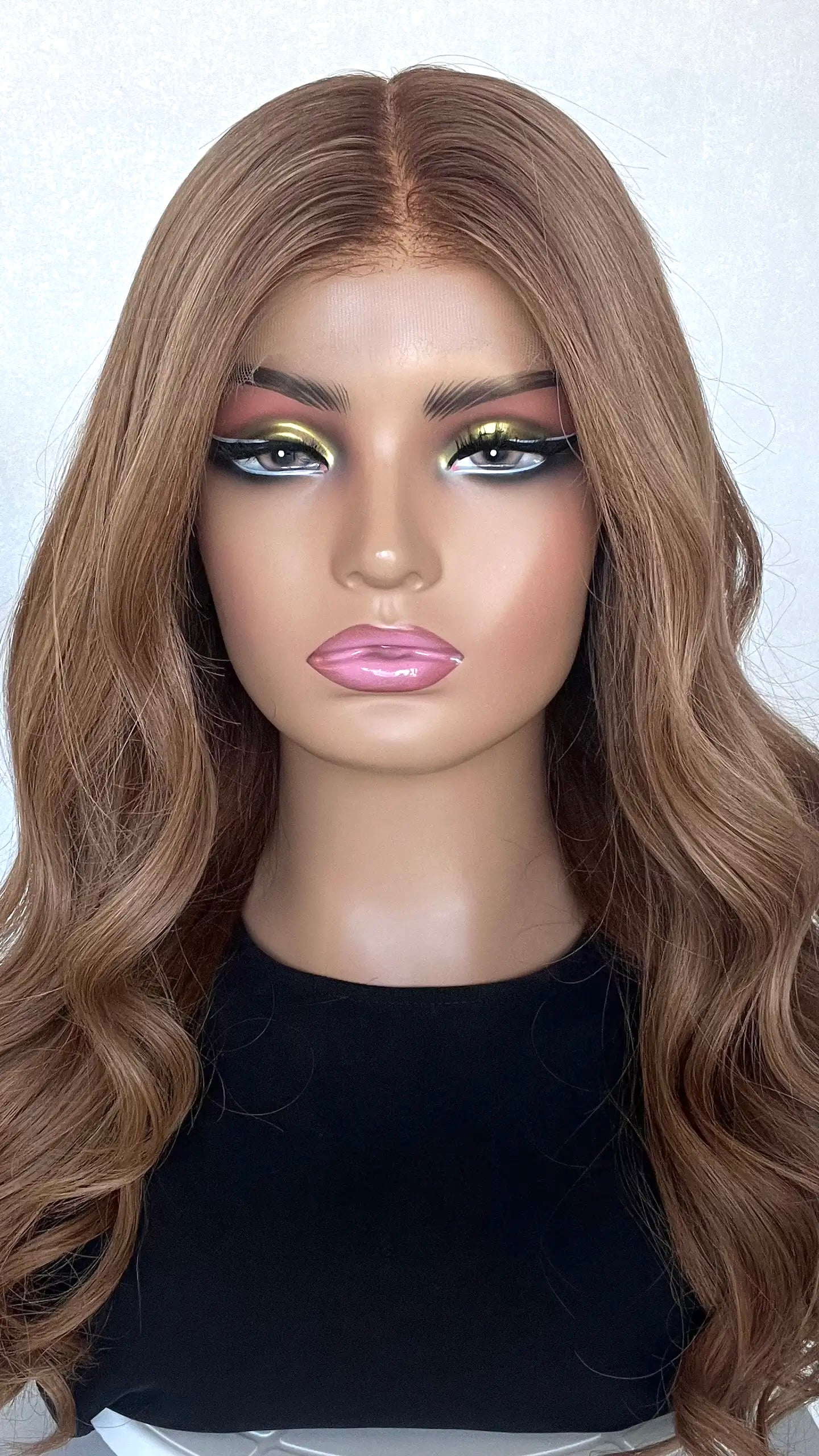 A 22-inch human hair lace front wig in rich dark copper blonde, featuring warm, fiery tones and a natural-looking hairline.