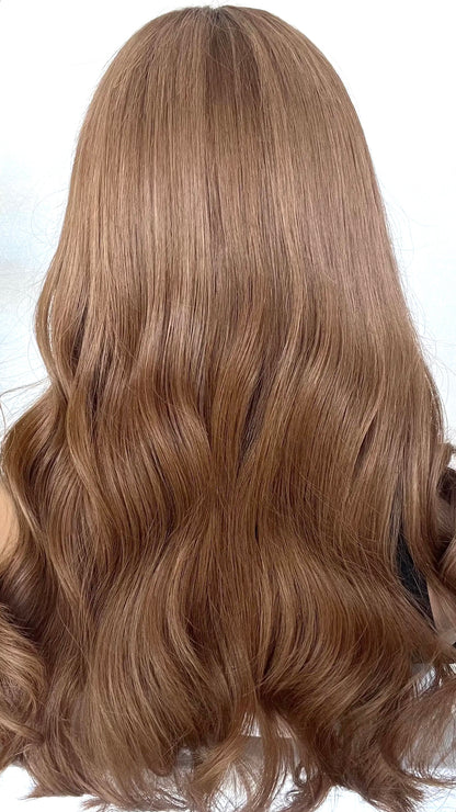 back view of the JESSICA wig, showcasing its vibrant dark copper blonde shade with soft, flowing layers for added volume