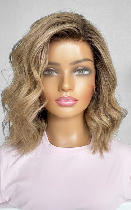 A 14-inch human hair lace front wig in warm blonde with soft highlights, offering a sun-kissed glow and natural movement