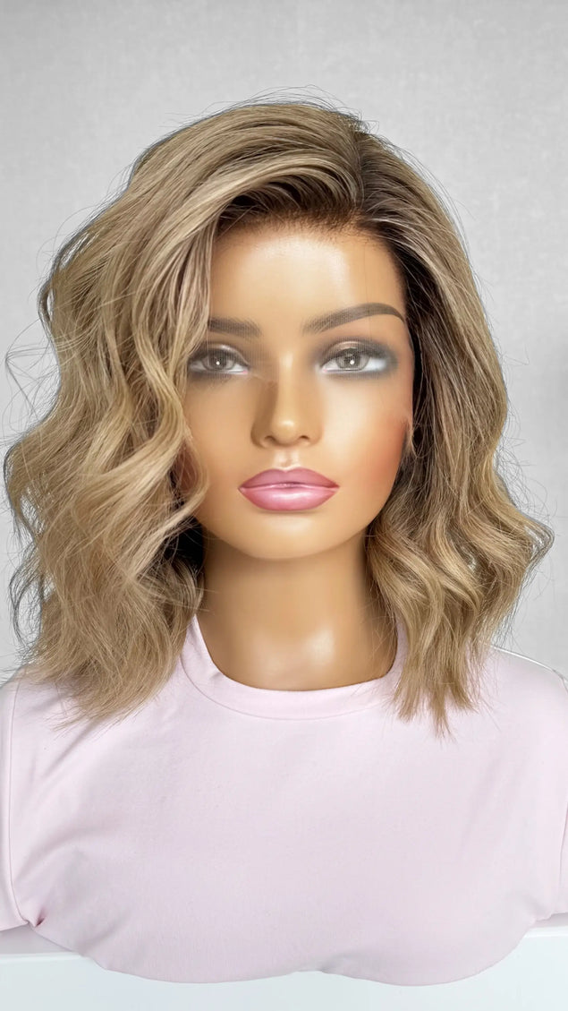 A 14-inch human hair lace front wig in warm blonde with soft highlights, offering a sun-kissed glow and natural movement