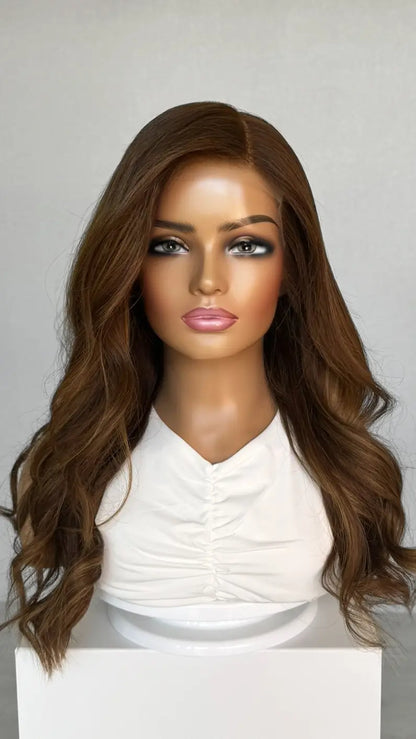 A 24-inch human hair lace front wig in warm copper brunette, featuring a rich, dimensional colour with soft, flowing layer