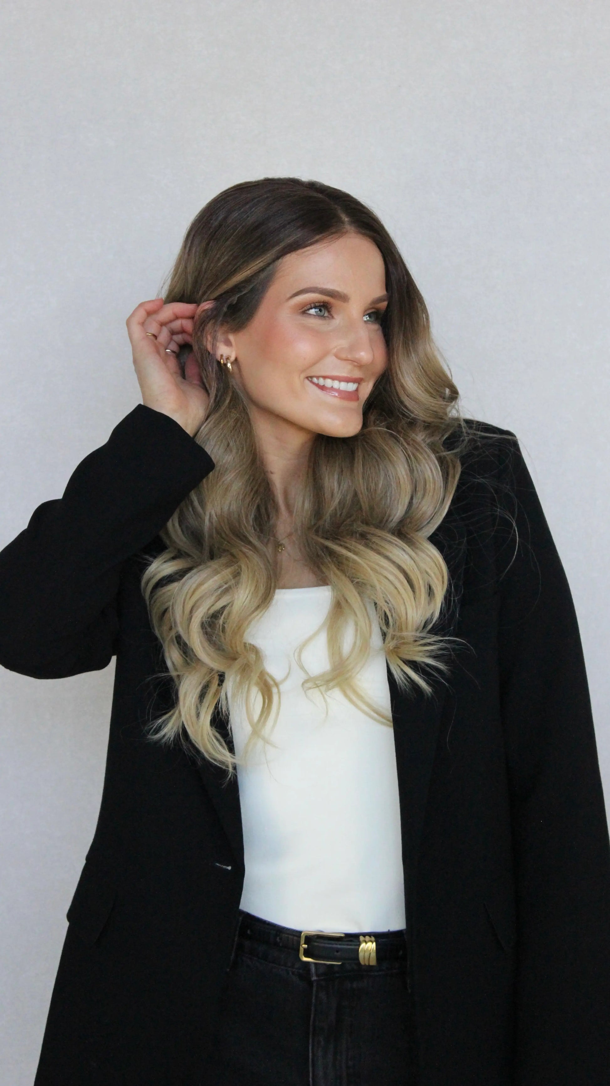 latte synthetic wig, middle part darker root to light blonde ends.