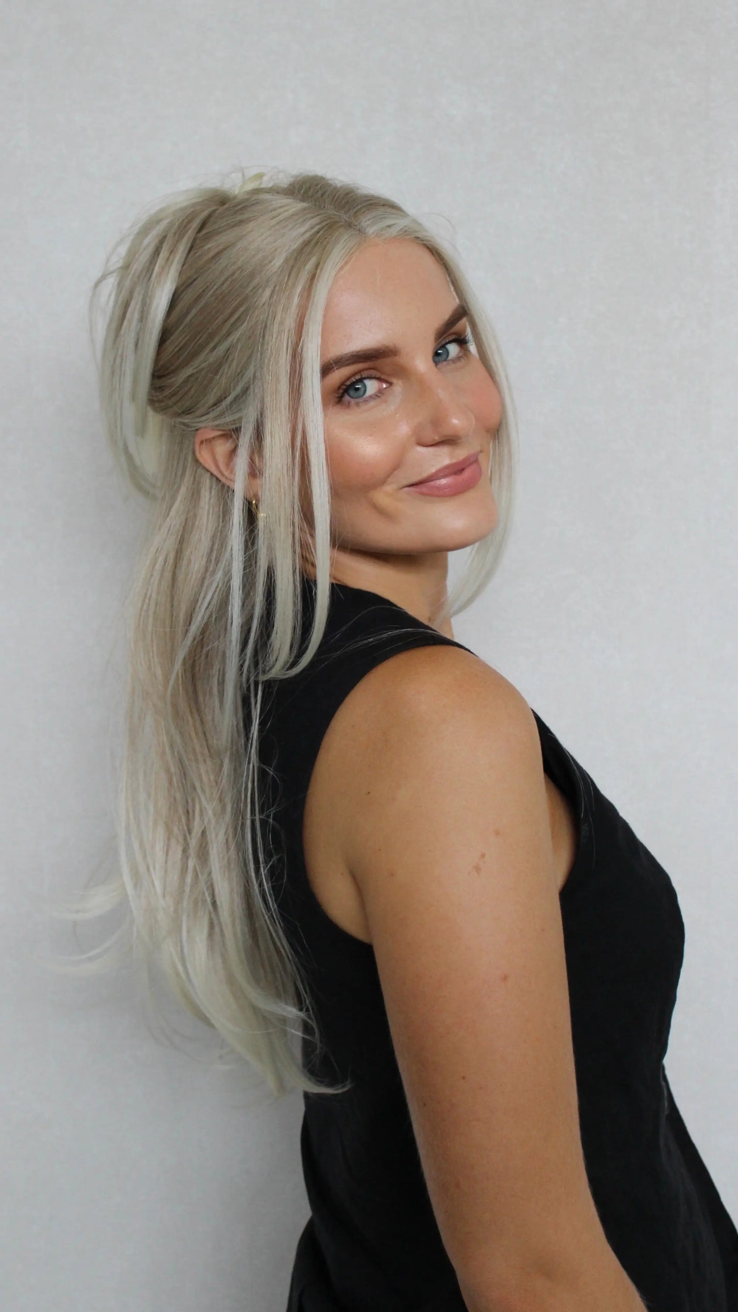 Bright Creamy Blonde Lace Front Layered Synthetic – Tinker, heat safe synthetic side on, tied back.