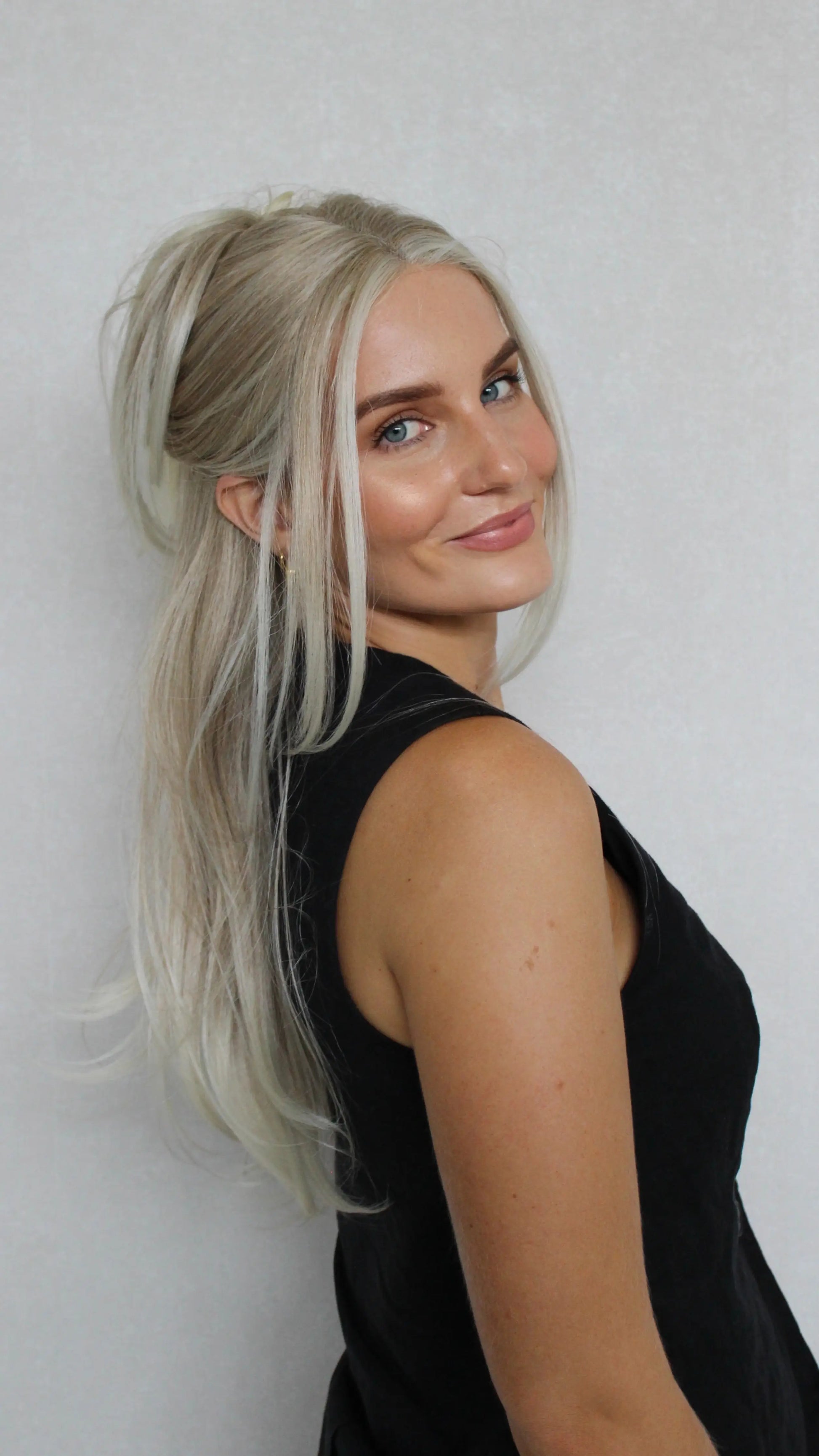 Bright Creamy Blonde Lace Front Layered Synthetic – Tinker, heat safe synthetic side on, tied back.