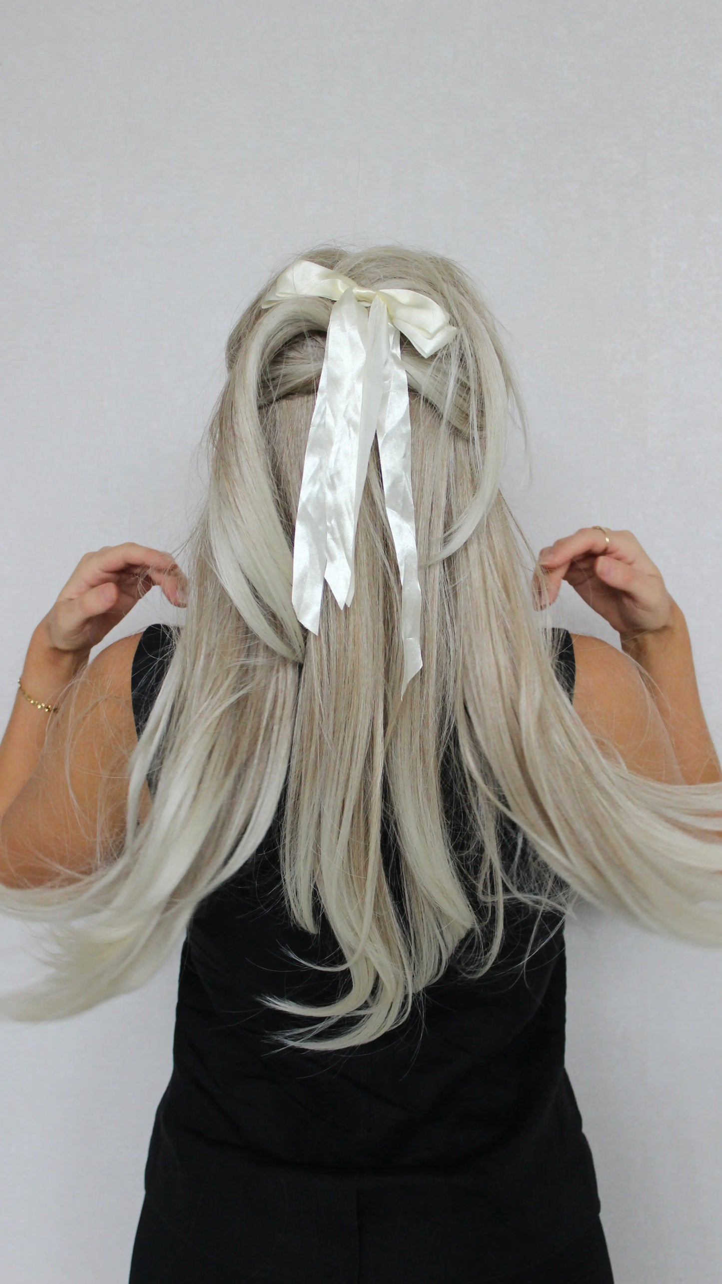 Layered Synthetic – Tinker from the back, hair tied up with bow clip. showing layered hair.