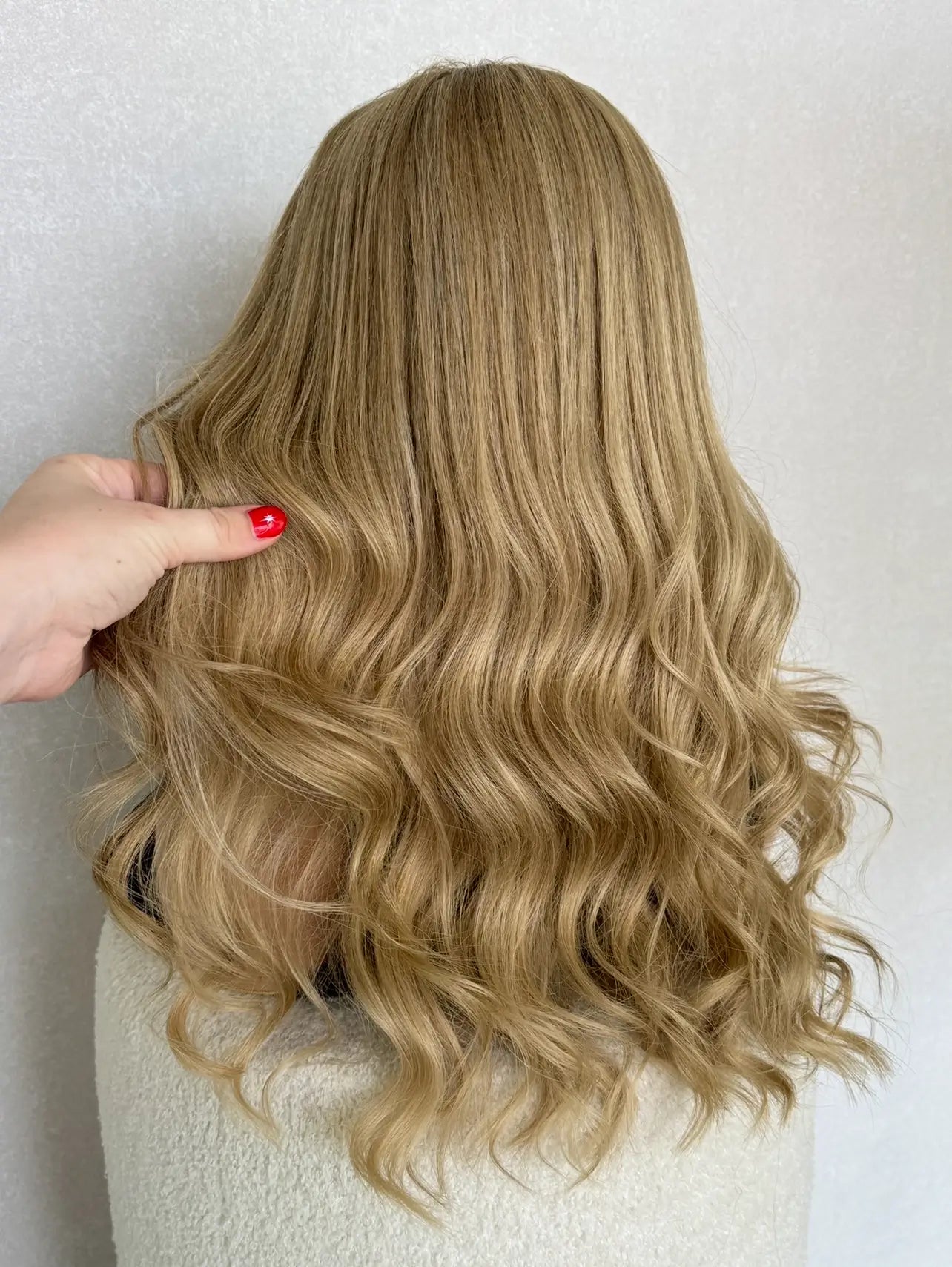 Back view of a 22-inch lace front wig in golden blonde