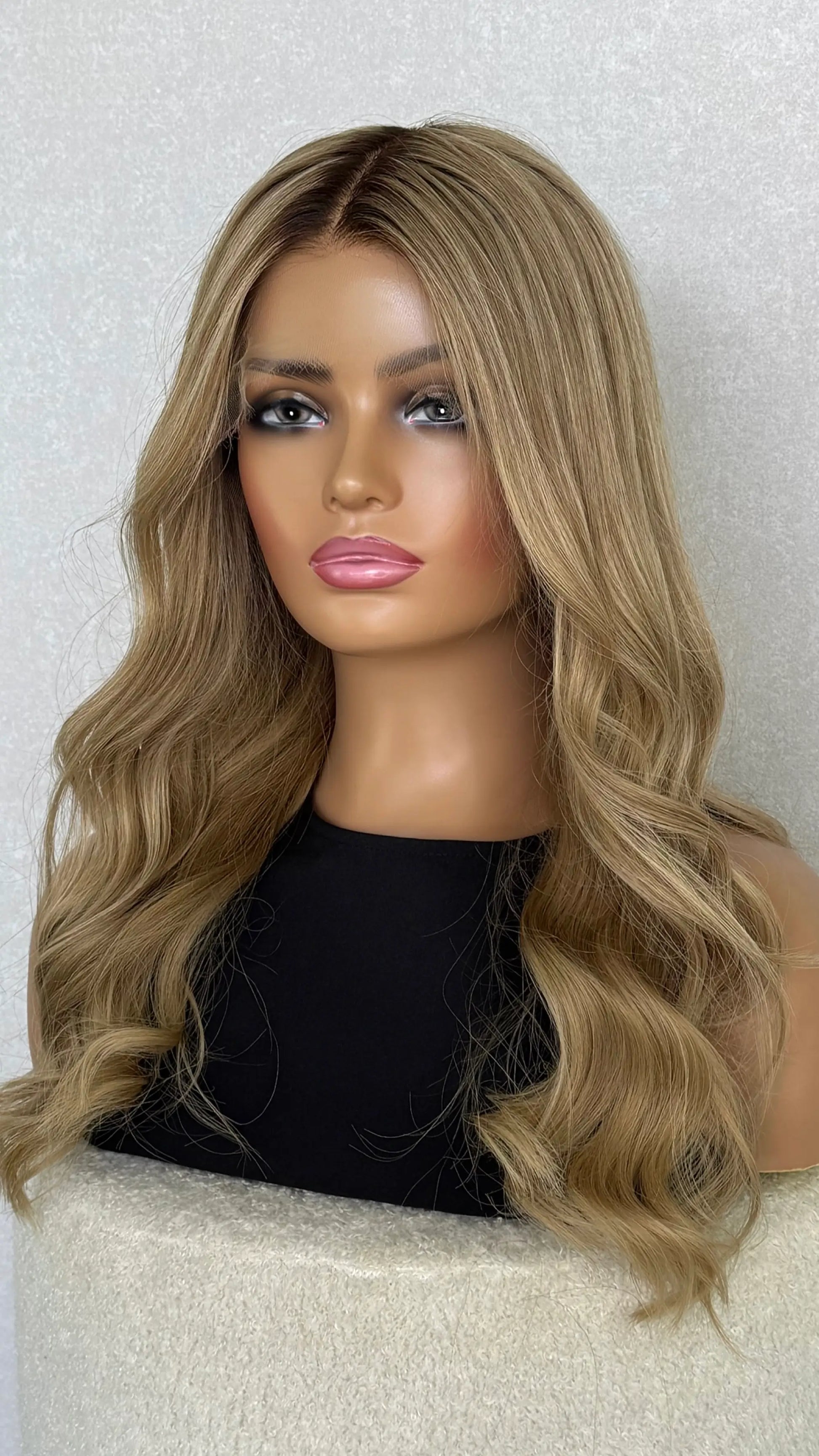 A close-up of the Light Golden Blonde human hair wig, showcasing soft highlights and silky texture
