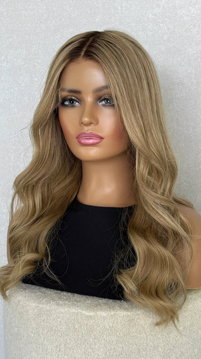 A close-up of the Light Golden Blonde human hair wig, showcasing soft highlights and silky texture