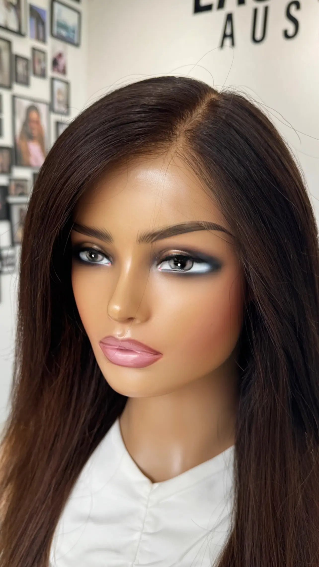 Close up shot of the Natise wig, showcasing its smooth transition from dark roots to rich, warm-toned highlights