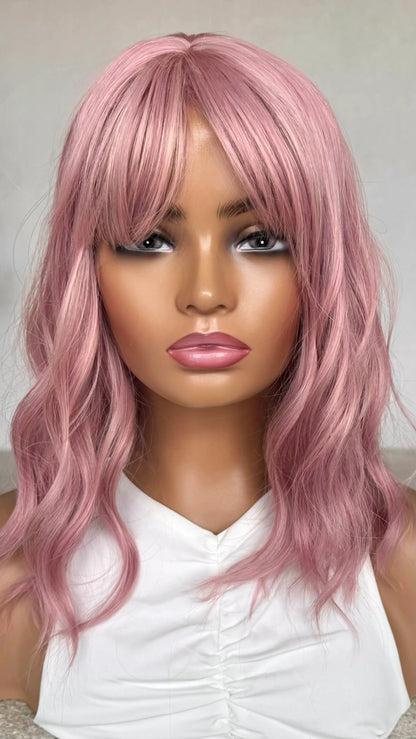Pearl Pink Wig front view, fringe parted to the side, heat safe synthetic hair. wavy bob.