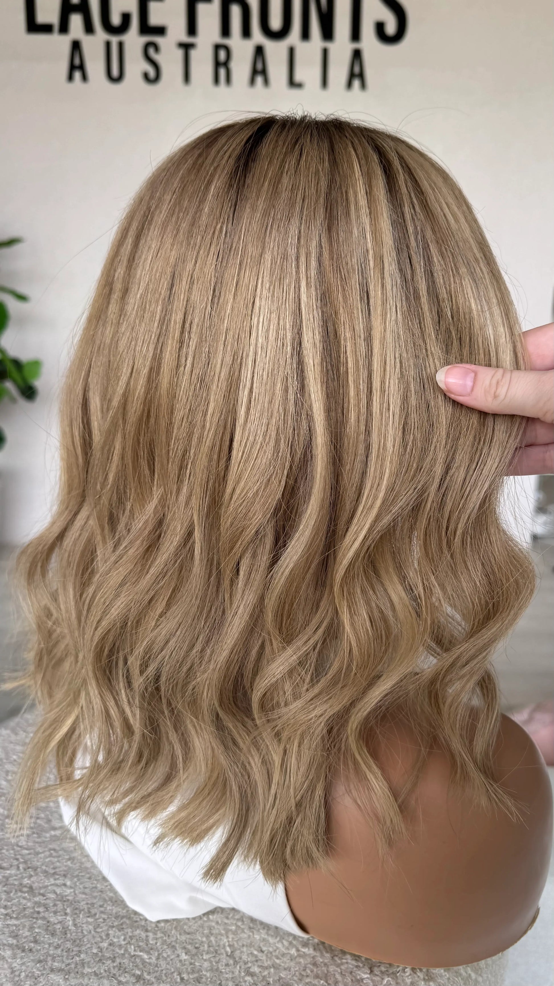 SALE- 14 INCH MULTI- TONED BLONDE HUMAN HAIR LACE FRONT WIG back view holding hair.