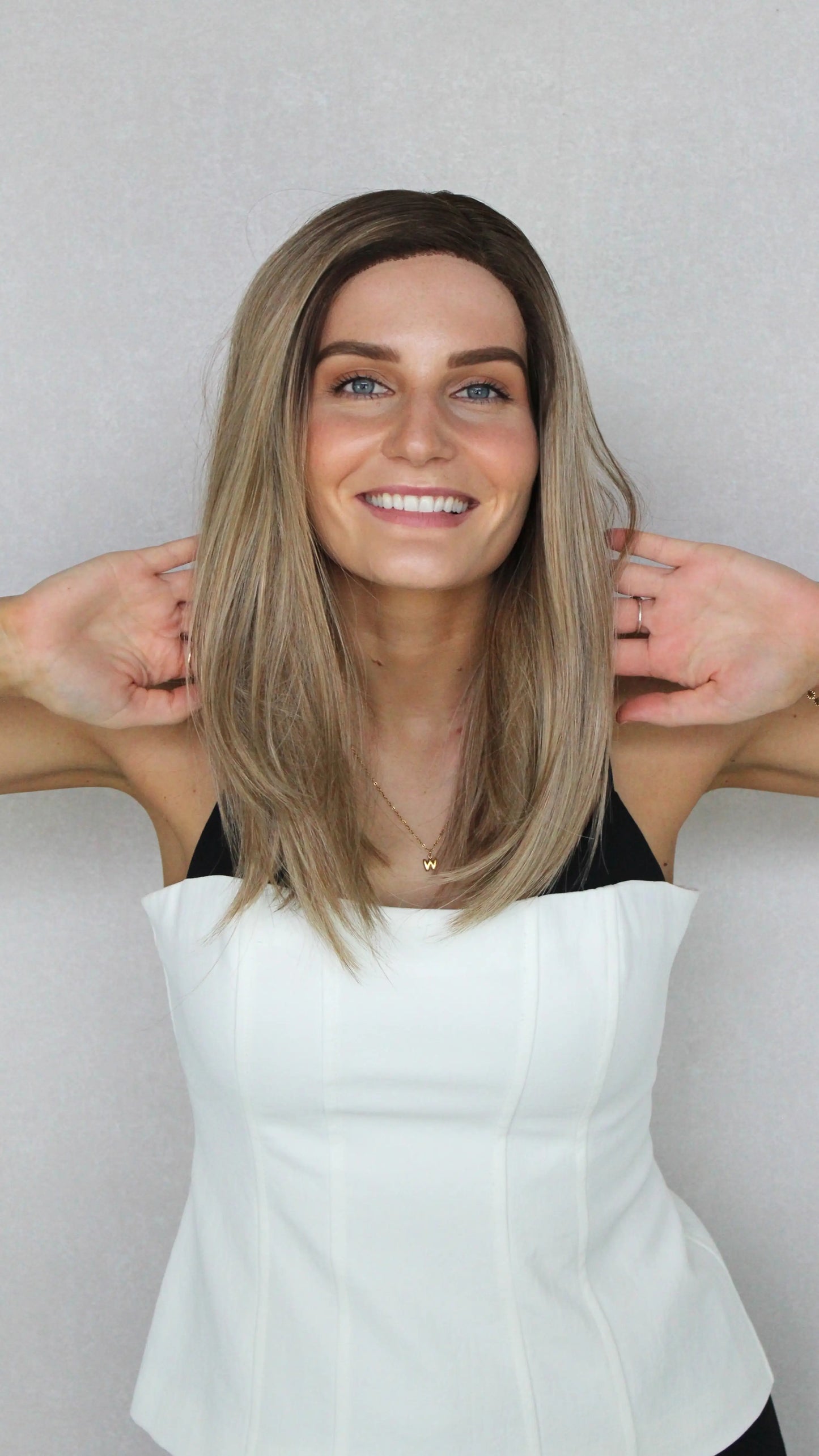 Multi-Toned Bronde with Root T-Part wig. heat safe synthetic, pulled forward to show colour in natural light.
