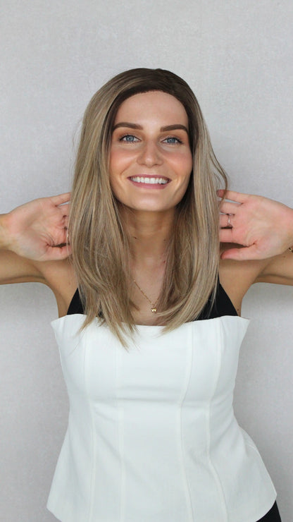 Multi-Toned Bronde with Root T-Part wig. heat safe synthetic, pulled forward to show colour in natural light.