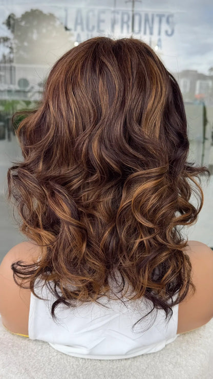 Curly wig with highlights from the back view. synthetic hair.