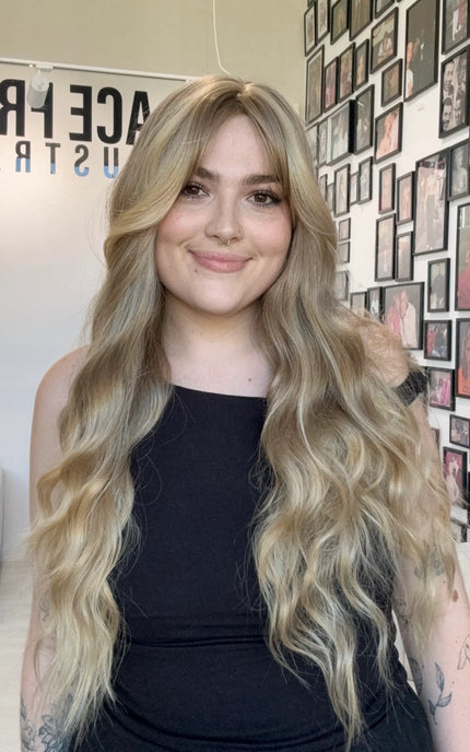 long wavy hair blonde synthetic topper, middle part with fringe.