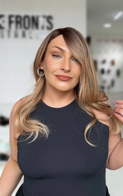 a soft curled golden ombre hair, with slight side part and medium length hair, a glueless easy to wear cap.