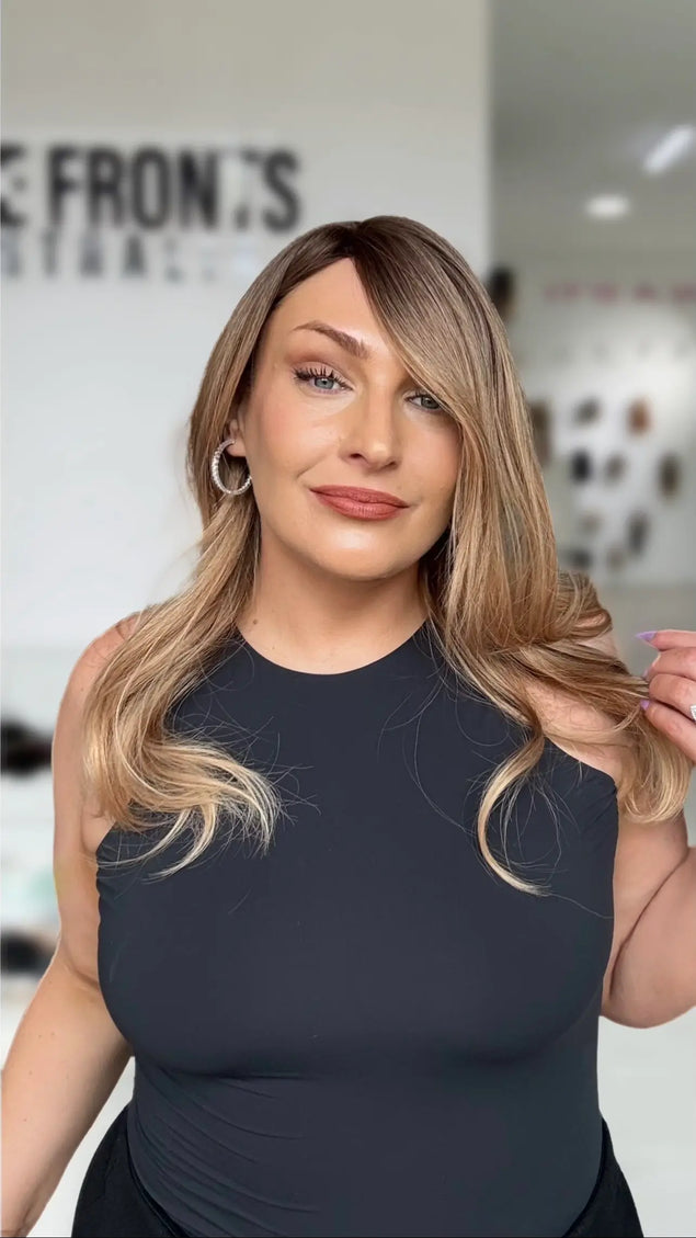 a soft curled golden ombre hair, with slight side part and medium length hair, a glueless easy to wear cap.