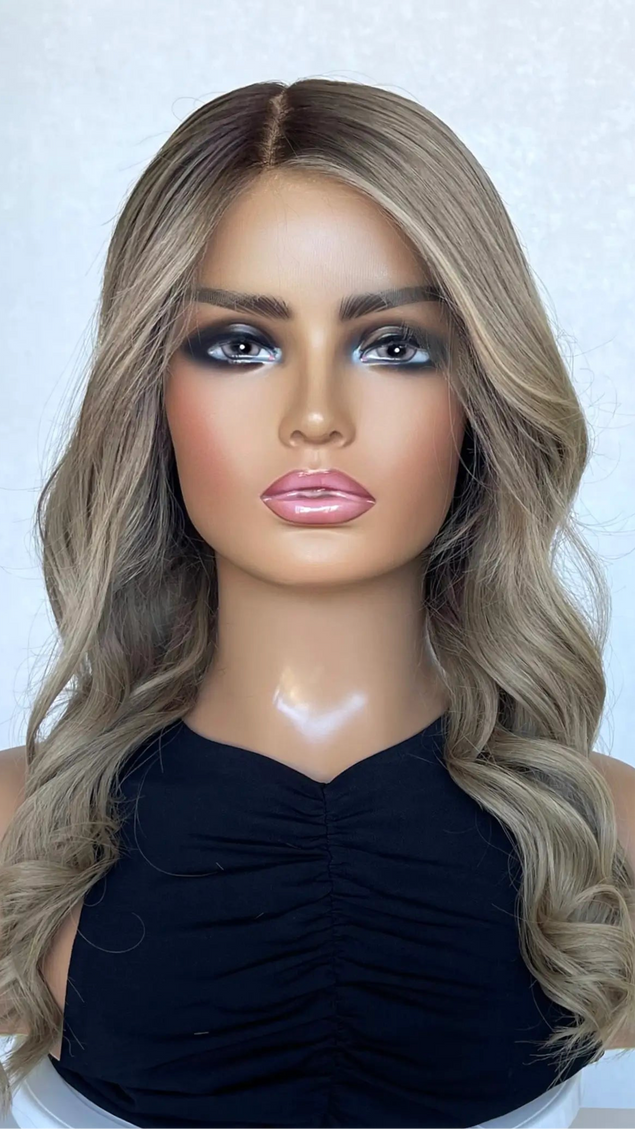 medical grade human hair lace wig with ash blonde curled hair.
