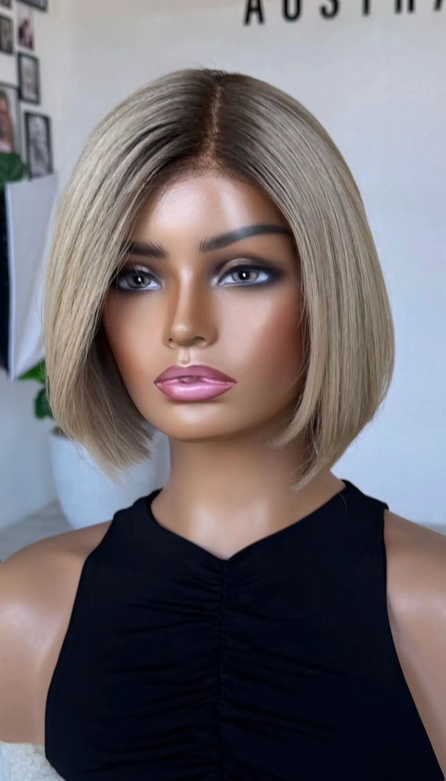 blonde bob length human hair lacev wig with glueless cap for daily wear.