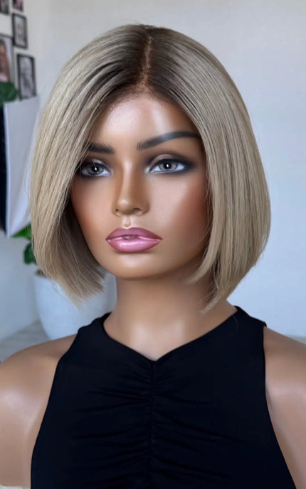 blonde bob length human hair lacev wig with glueless cap for daily wear.