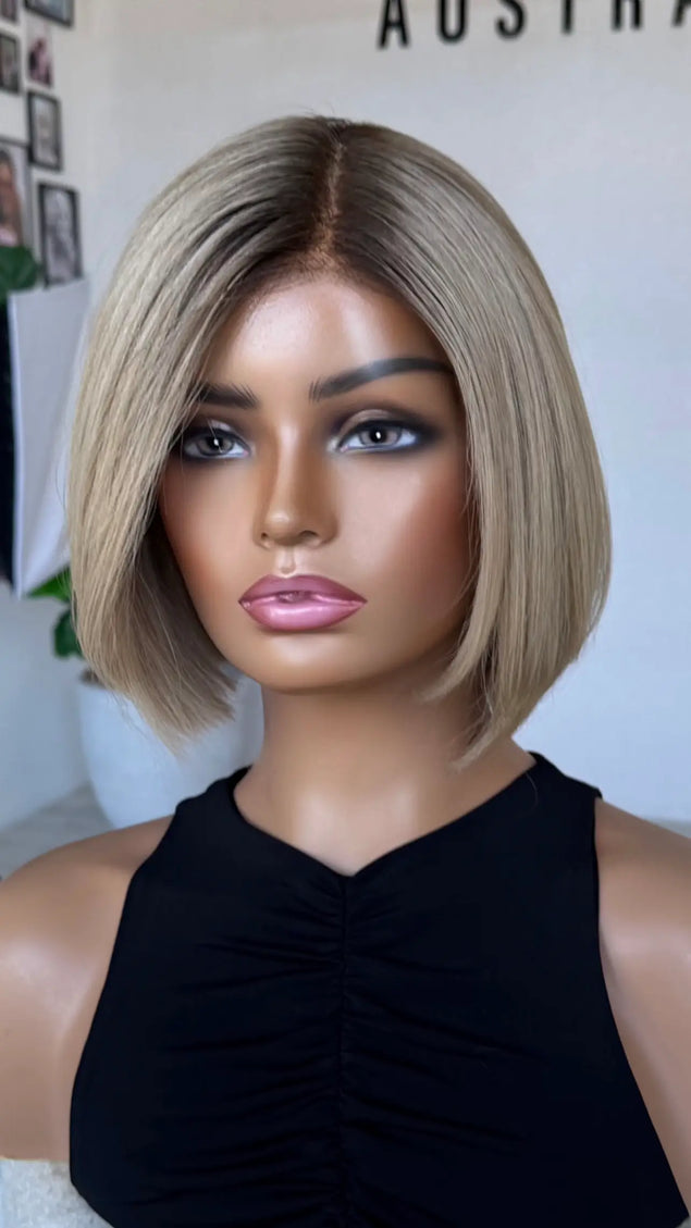 blonde bob length human hair lacev wig with glueless cap for daily wear.