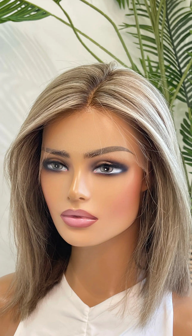 Side view of the Lily wig, showcasing its expertly blended beige blonde shade with delicate lowlights for depth and movement