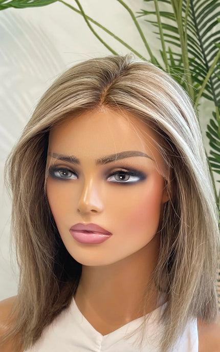 Side view of the Lily wig, showcasing its expertly blended beige blonde shade with delicate lowlights for depth and movement