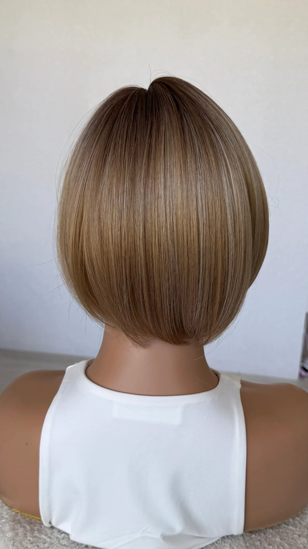 back view 10 inch synthetic hair topper, mixced warm toned blonde.