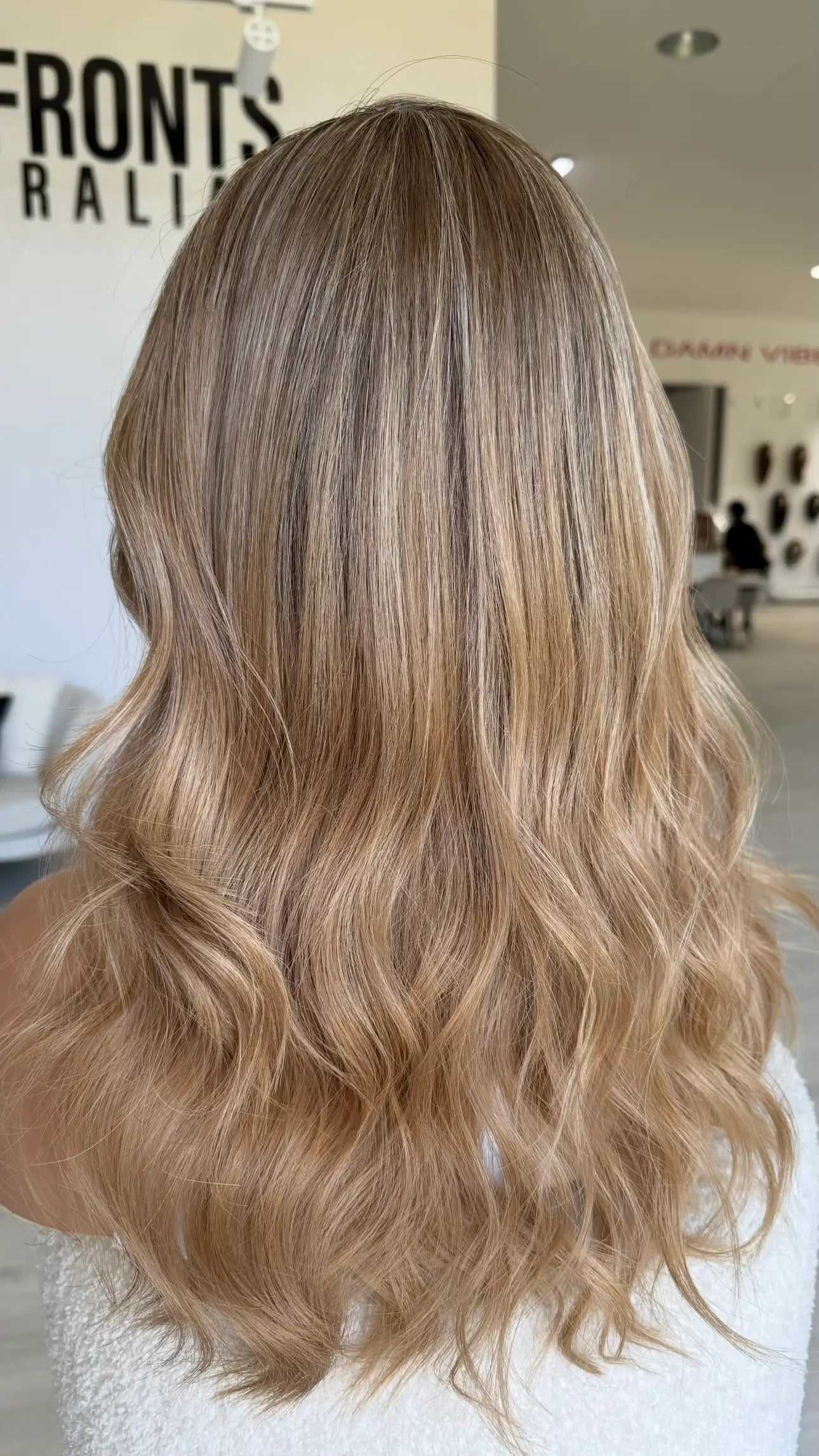 22 inch long hair wig from back view, multi toned blonde wig warm toned