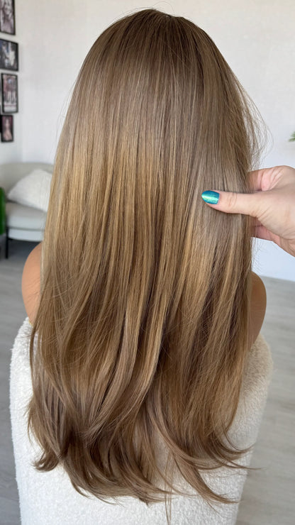 back view holding long layered hair, blonde ombre colour, wigs australia. gold coast.