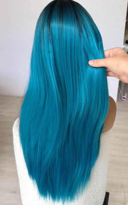 blue long hair synthetic wig, holding long hair from back view, straight hair, heat safe wig.
