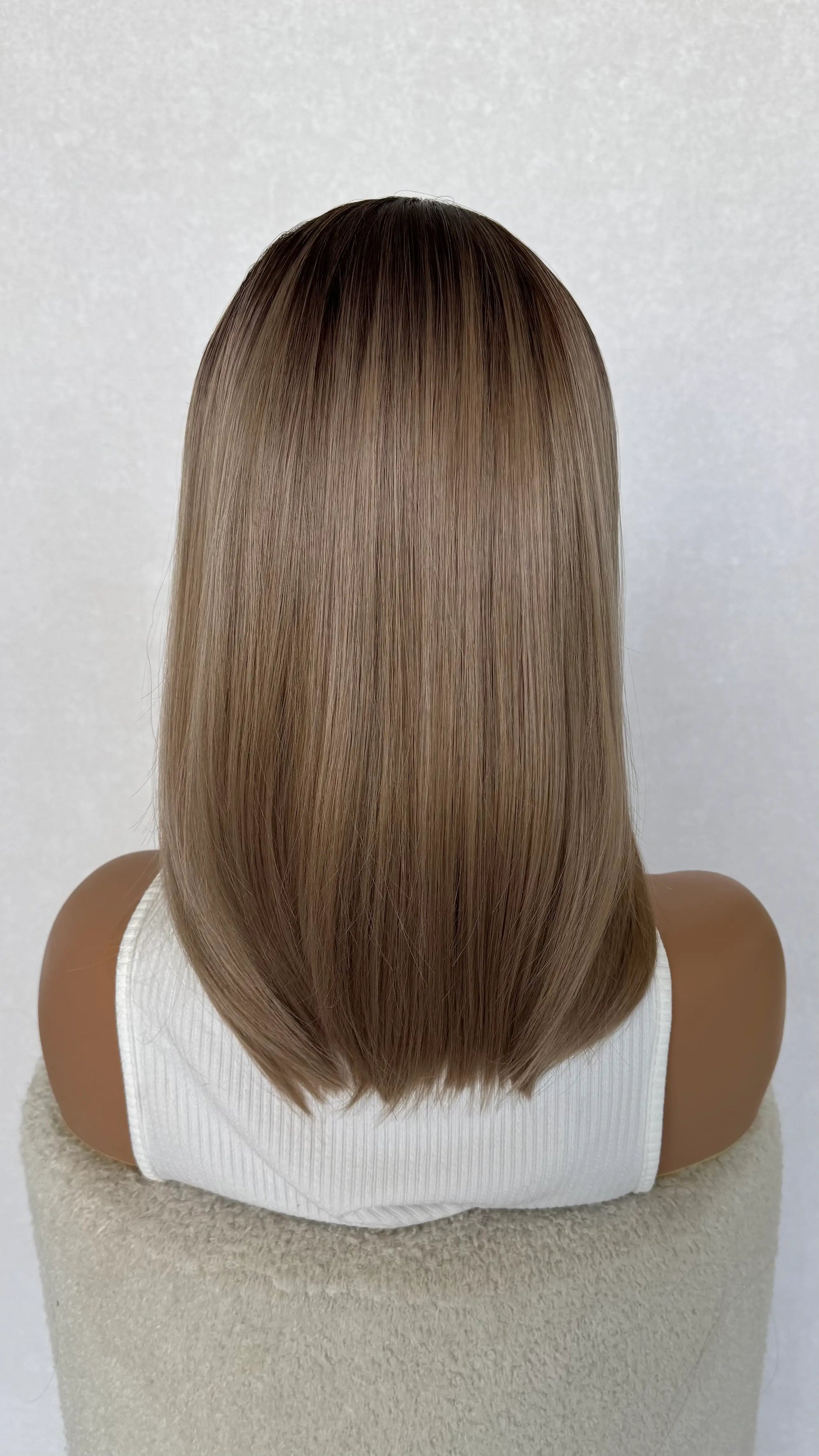 champagne toned hair, darker root. glueless heat safe wig australia.