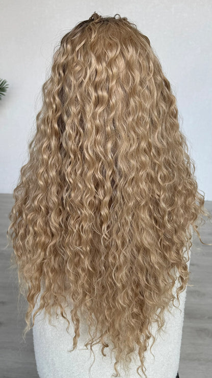 destiny wig from the back view, long curly hair, lacefront synthetic wig, heat safe.