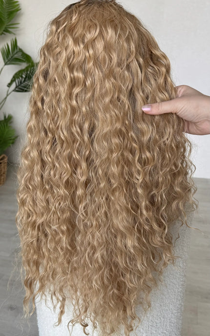 back view holding the long curly hair, 28 inch length.