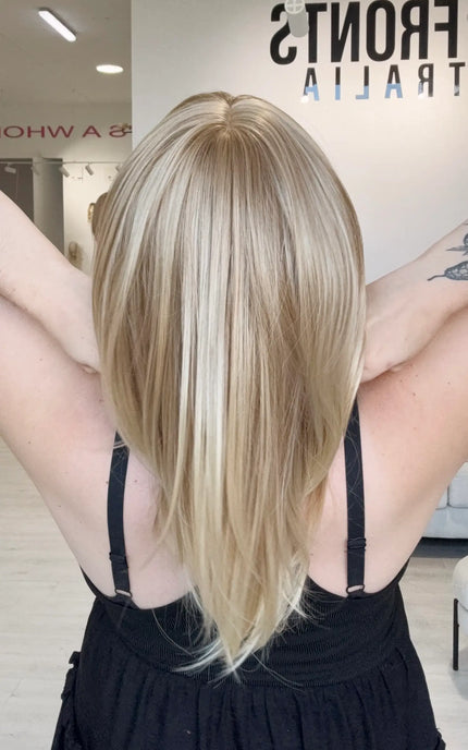 ready to wear, glueless sandy blonde wig with middle part.