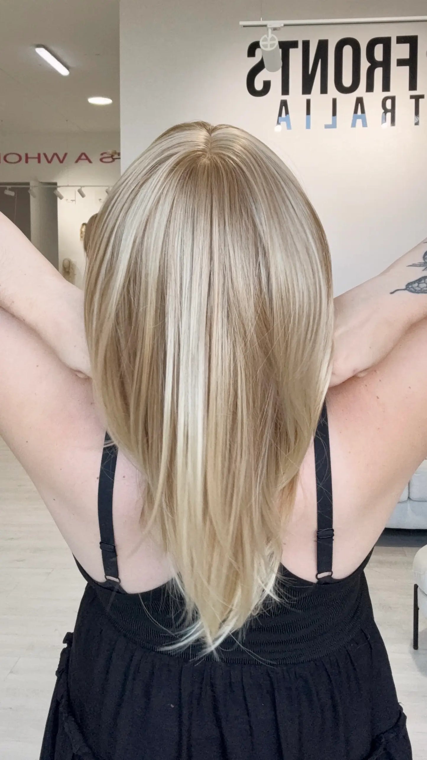 ready to wear, glueless sandy blonde wig with middle part.