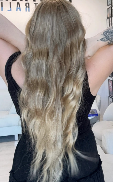 long wavy blonde hair with highlights, middle parting with fringe. heat safe glueless toppers australia.