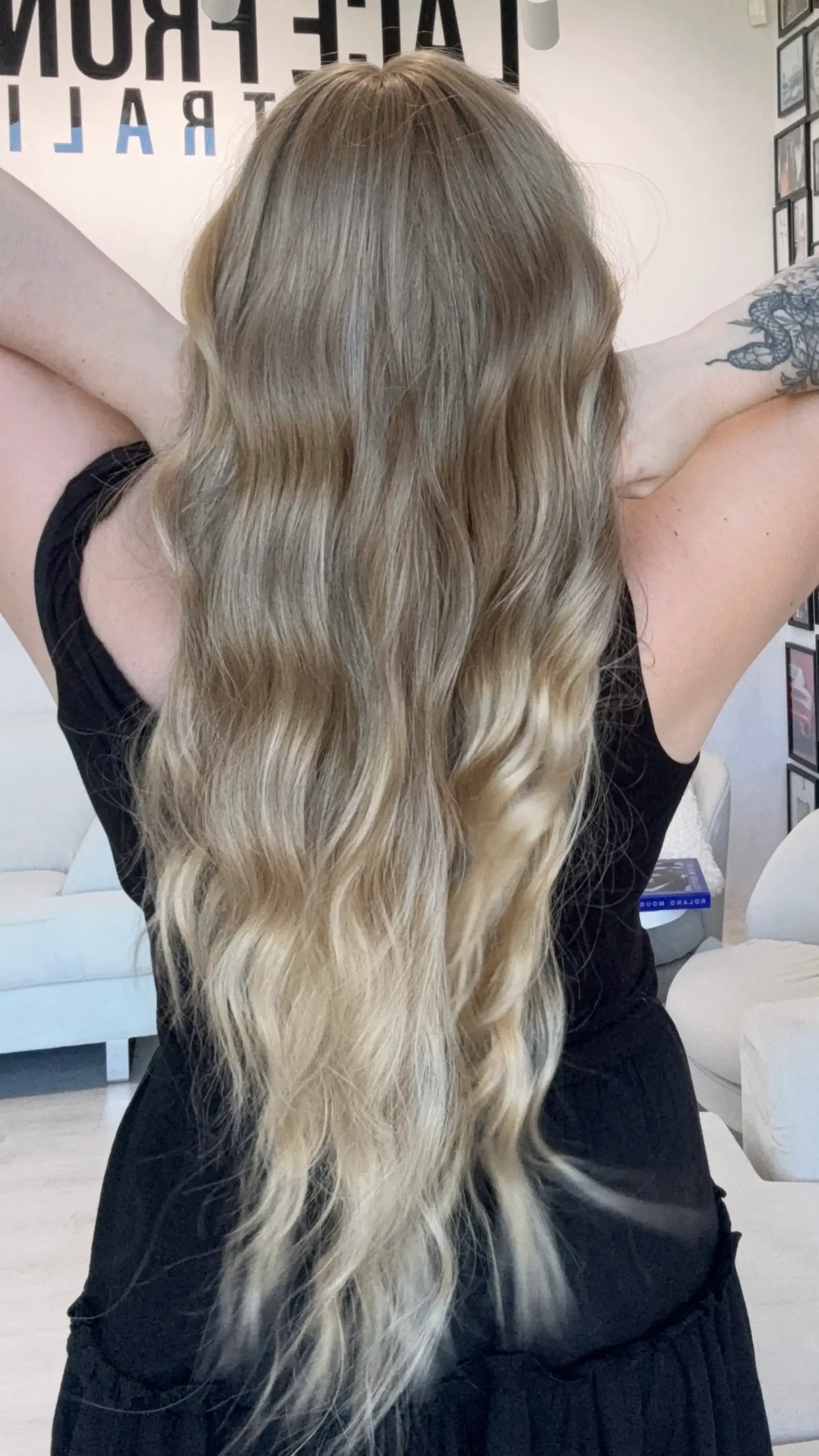 long wavy blonde hair with highlights, middle parting with fringe. heat safe glueless toppers australia.