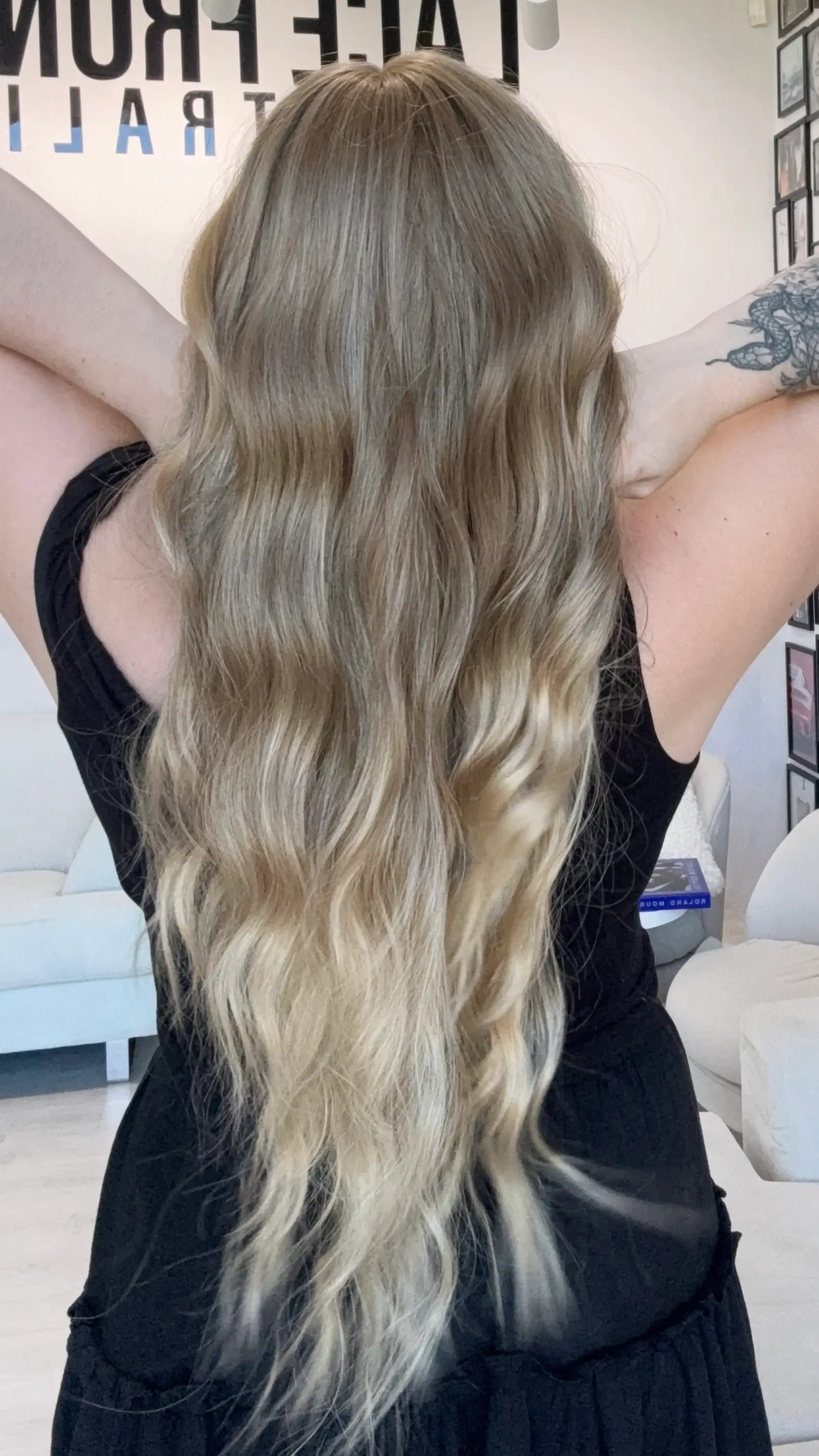 long wavy blonde hair with highlights, middle parting with fringe. heat safe glueless toppers australia.