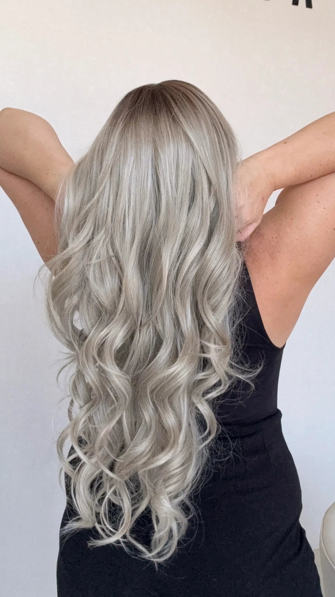 australia synthetic wigs, ash blonde hair curled from back view, long length synthetic hair australia.