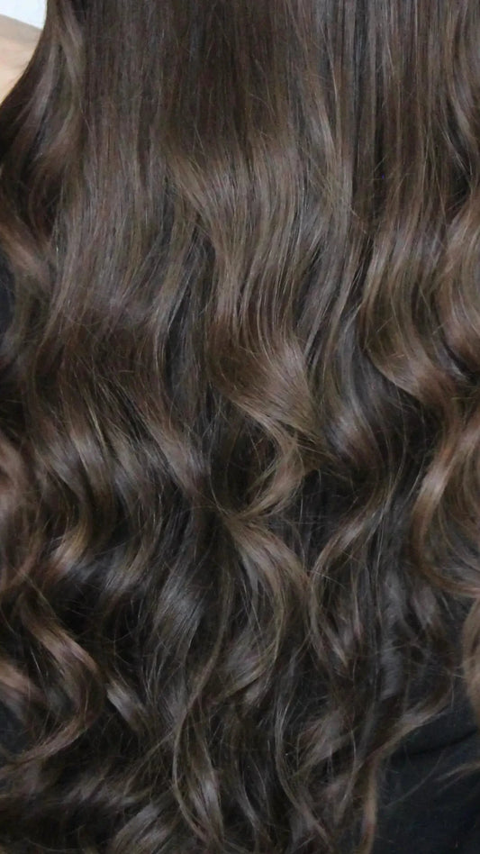 back view, long kai wig, dark brown hair with warm highlights around face. curly hair, lacefront human hair wig australia.