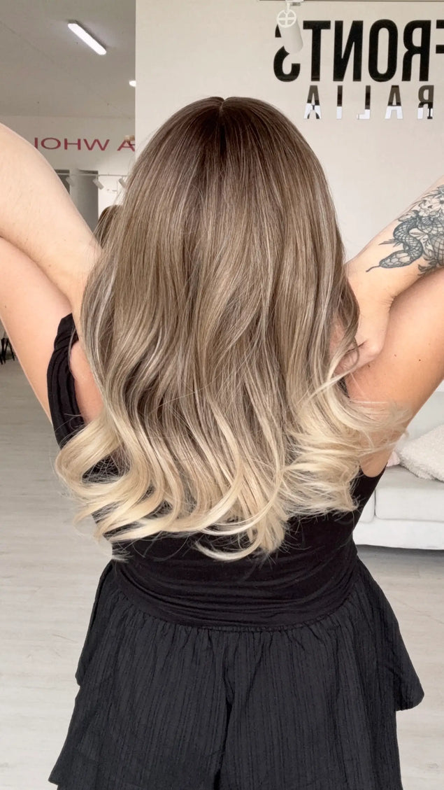 back view of hair showing ash ombre colour with a soft curl on ends, can be heat styled to customise further.