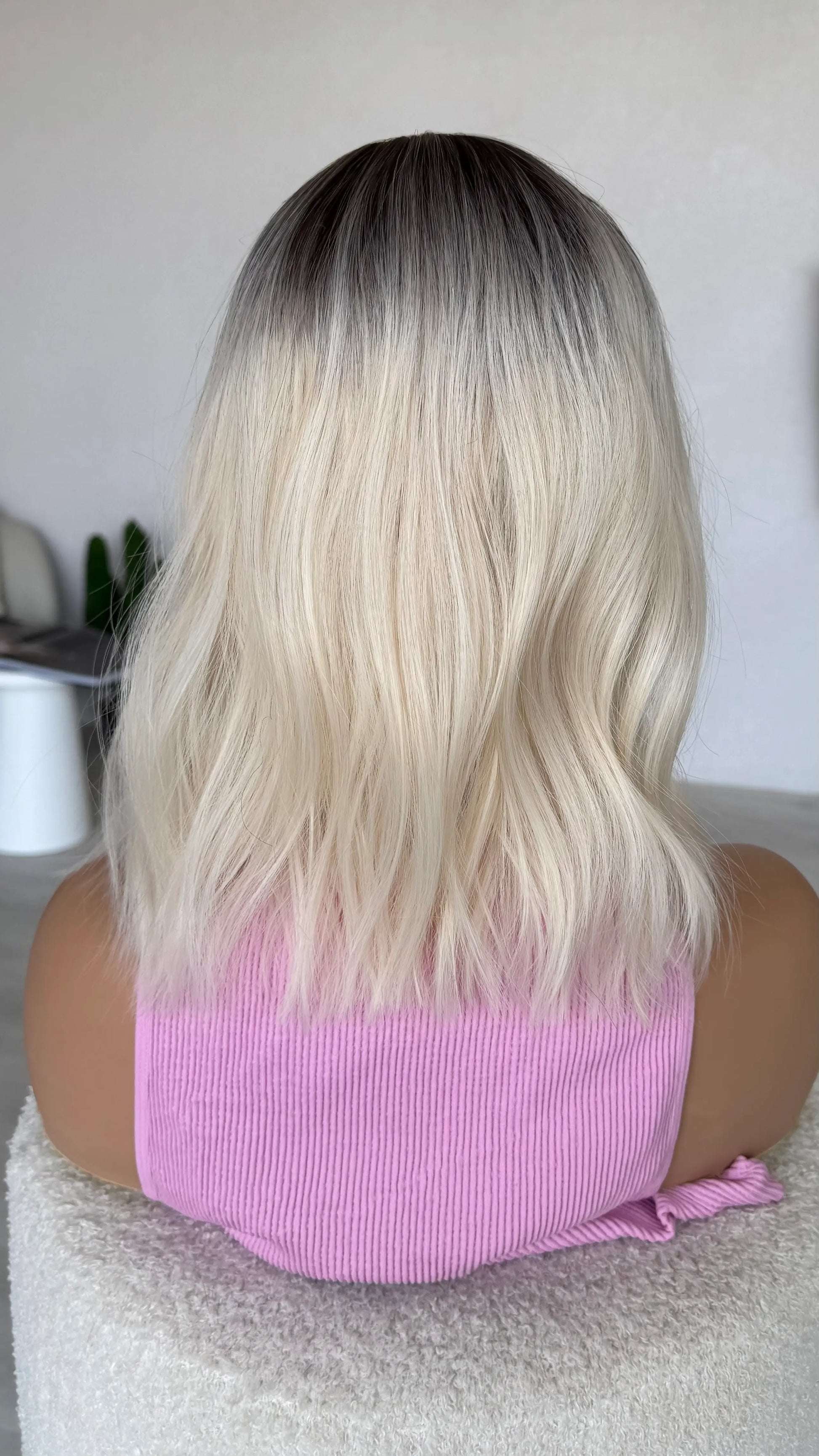 wavy fringe wig bob, back view platinum blonde hair.
