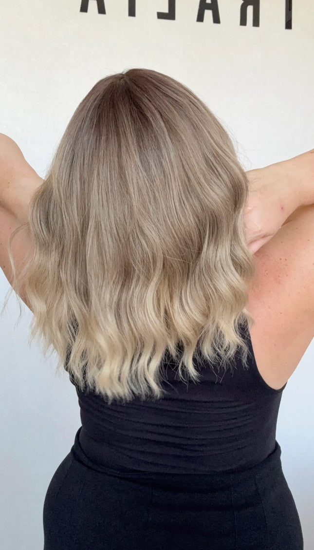 heat safe wavy ombre hair, middle part with fringe from back view.