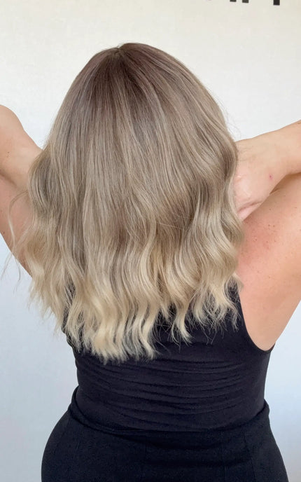 heat safe wavy ombre hair, middle part with fringe from back view.