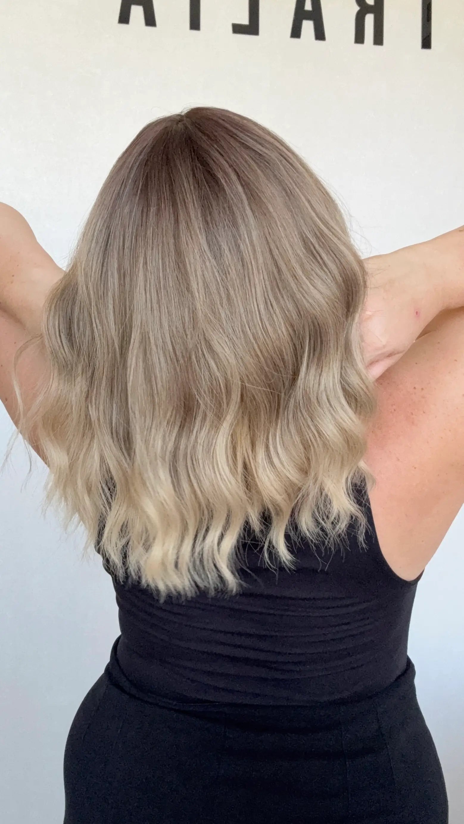 heat safe wavy ombre hair, middle part with fringe from back view.