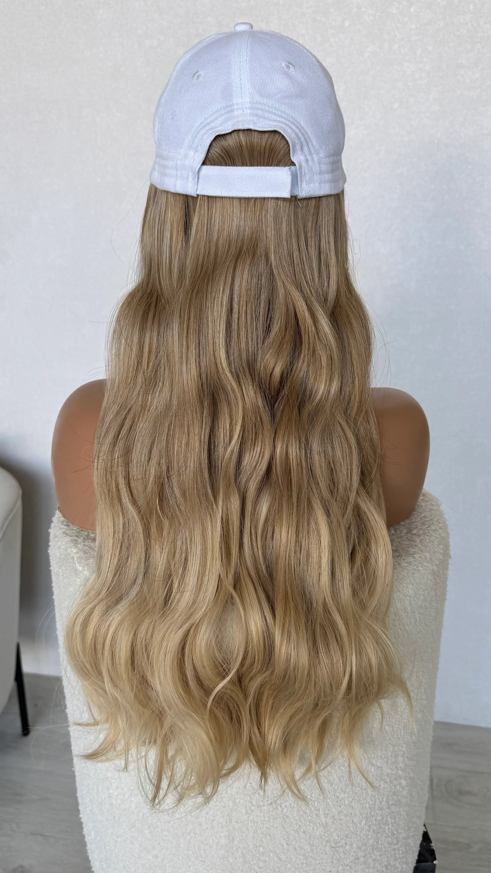 wavy blonde hair from behind hat wig australia, natural wigs.