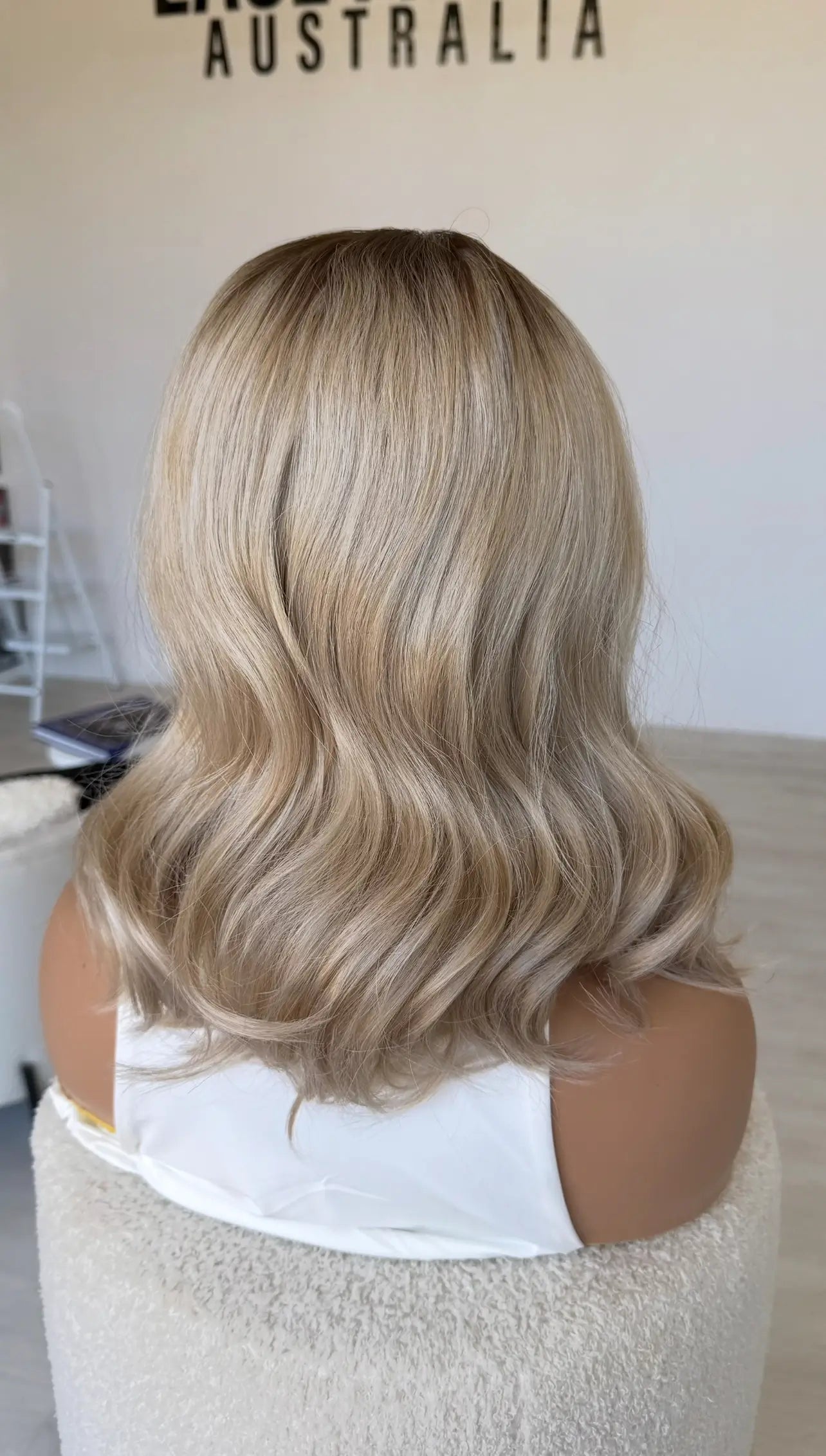 wavy ash sandy blonde synthetic hair, glueless wig, heat safe synthetic hair, 14-16 inch length with waves and middle part.