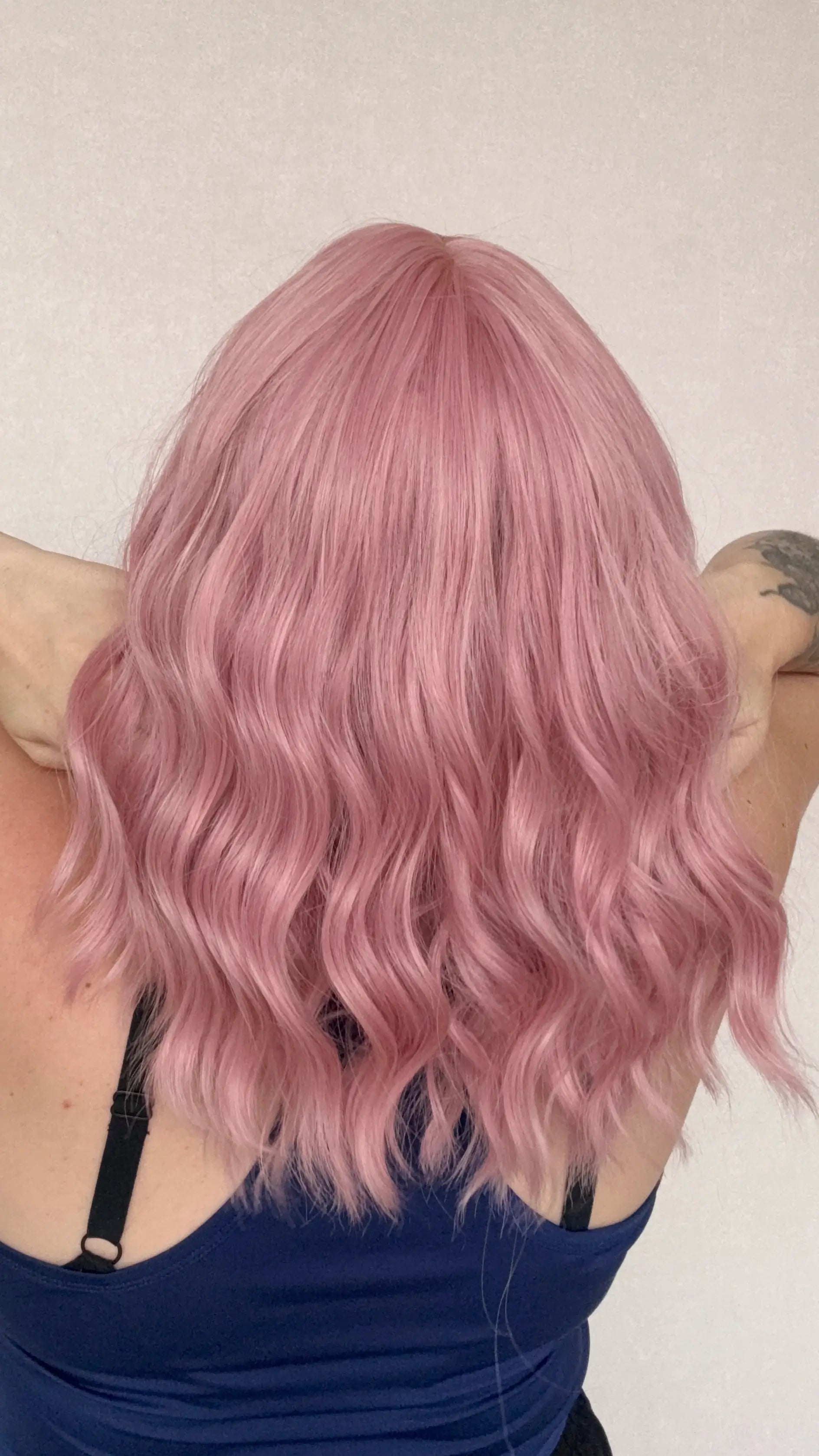 synthetic wigws australia, pink wavy hair wig with middle part and fringe. gold coast australia.